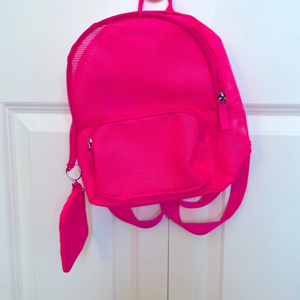 Like new, waterproof hot pink book bag